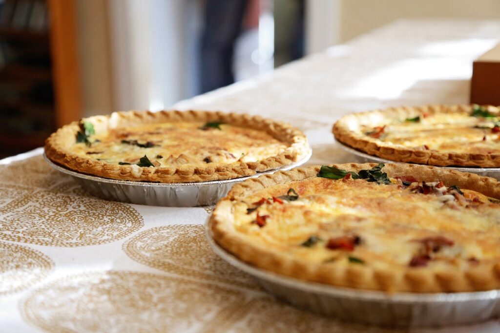 Three quiches on a table.