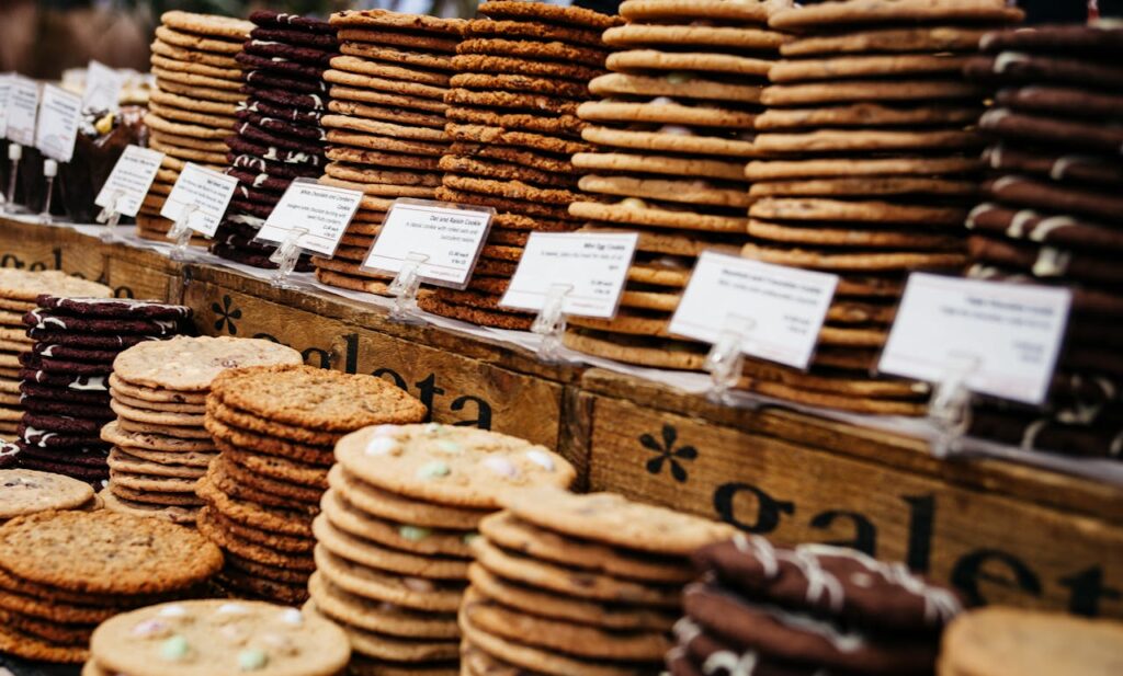 Stacks of cookies on a bakery counter.