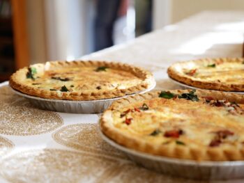 Three quiches on a table.