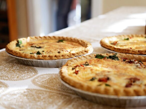 Three quiches on a table.