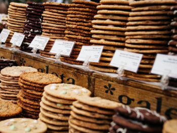 Stacks of cookies on a bakery counter.