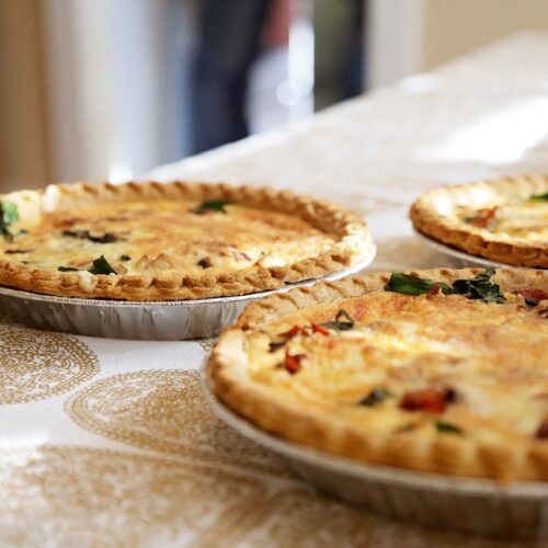 Three quiches on a table.