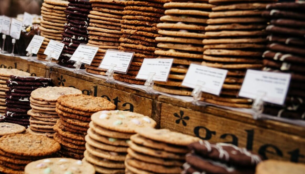 Stacks of cookies on a bakery counter.