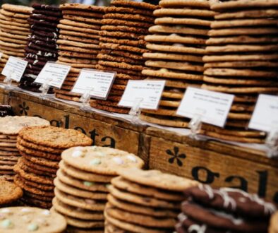 Stacks of cookies on a bakery counter.