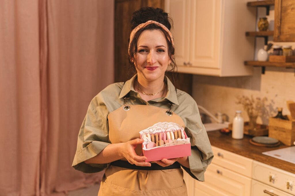A Woman Holding a Box of Macaroons.
